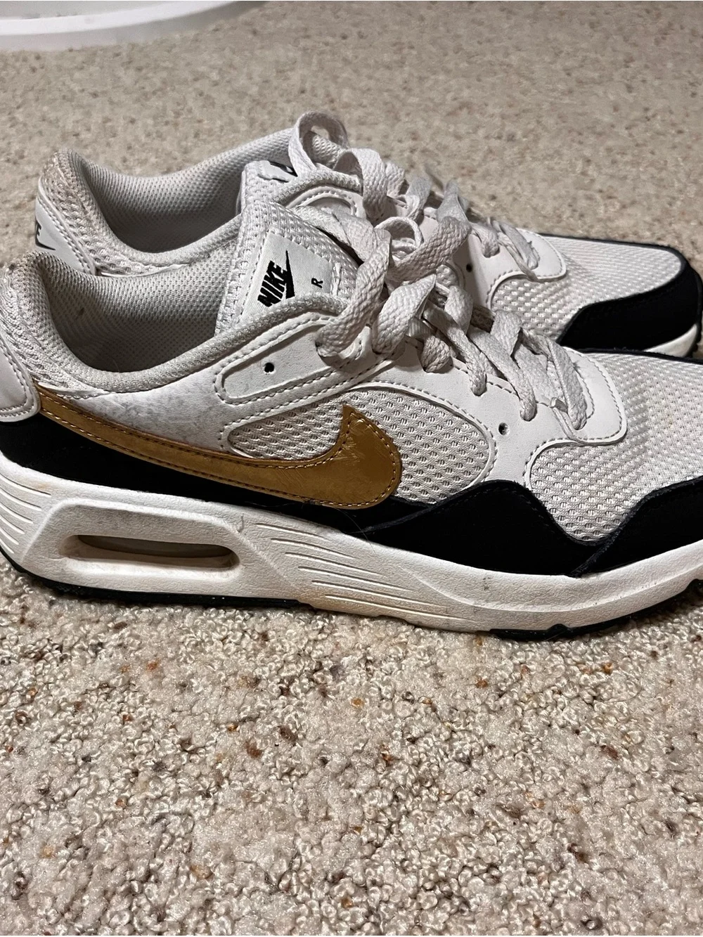 Nike White and Black Mesh Sneakers with Gold Swoosh